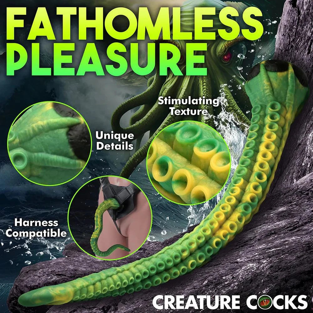 Creature Cocks Titan Tentacle extra long green and yellow silicone dildo with textured suckers, harness compatible and suction cup base for hands-free use.