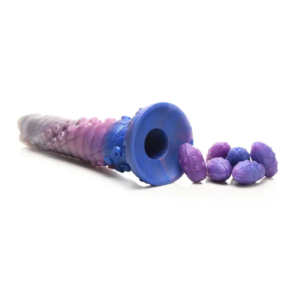 Creature Cocks Tenta-Queen Ovipositor Silicone Dildo with Eggs in vibrant blue and purple tones, featuring a ribbed tentacle shaft and included silicone eggs.