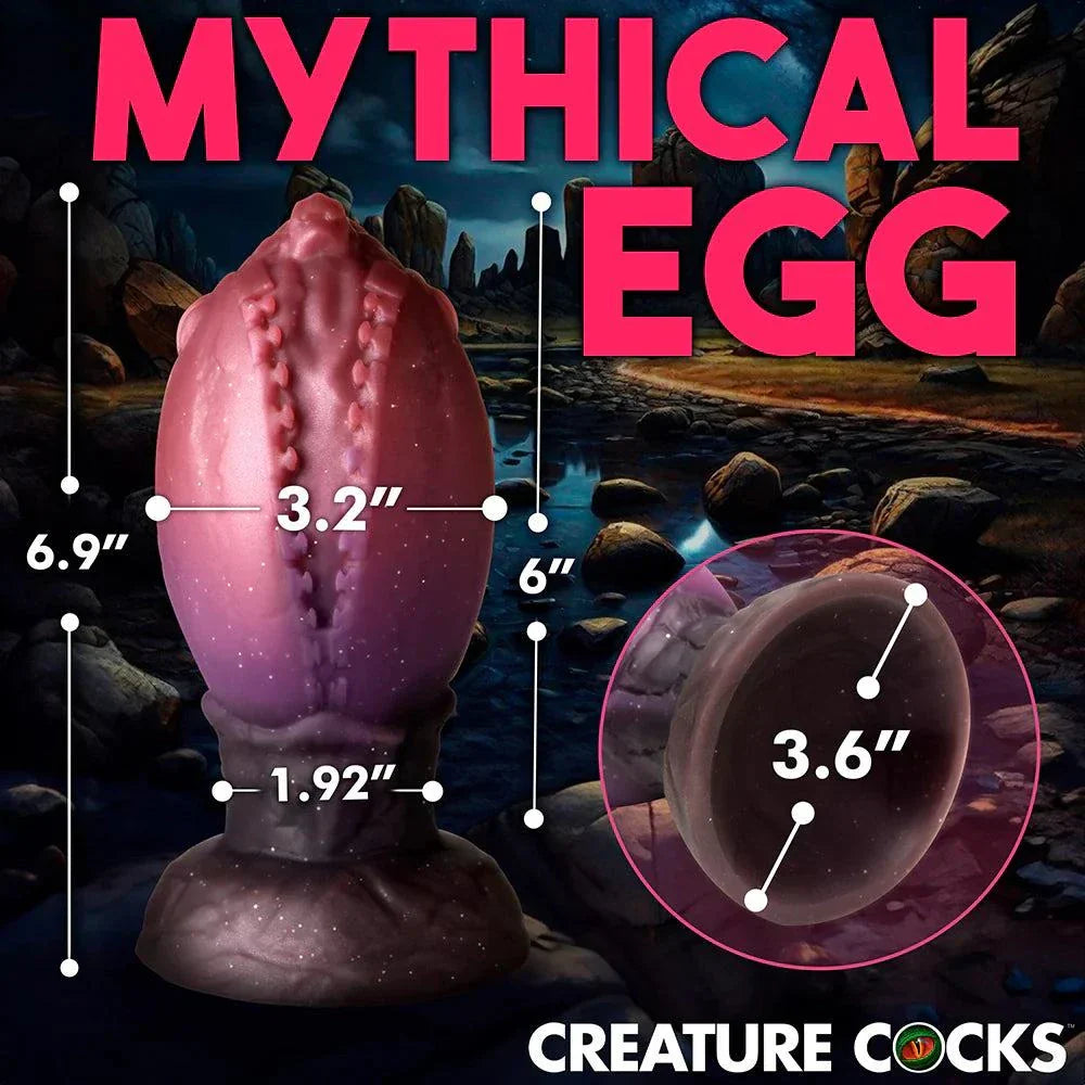 XL glittery silicone dragon egg with textured ridges and tapered tip for fantasy role-play.