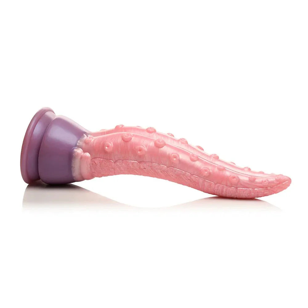 Creature Cocks Octoprobe tentacle-shaped silicone dildo with suction cup base in pink and purple, featuring textured suckers and tapered tip for varied sensations.