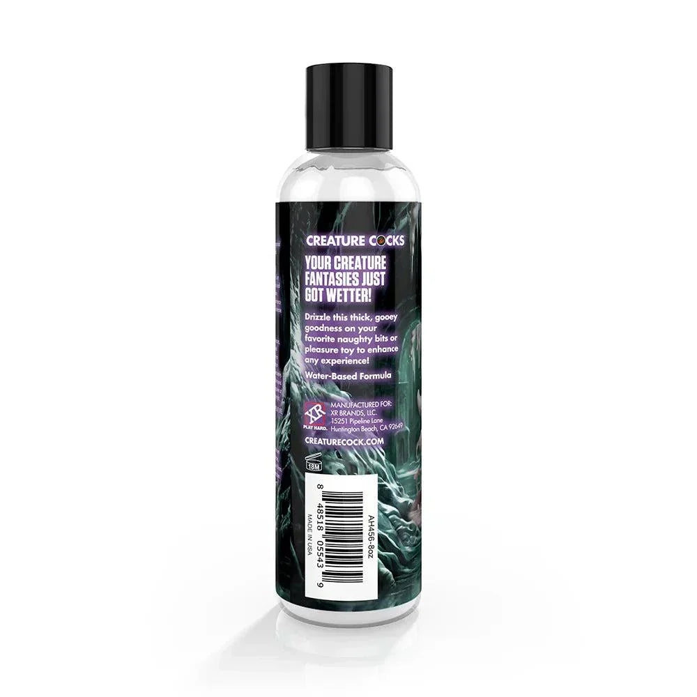 Creature Slime Creature Cum Unscented Jizz Lubricant 8 oz. bottle with black cap and label featuring vibrant design.