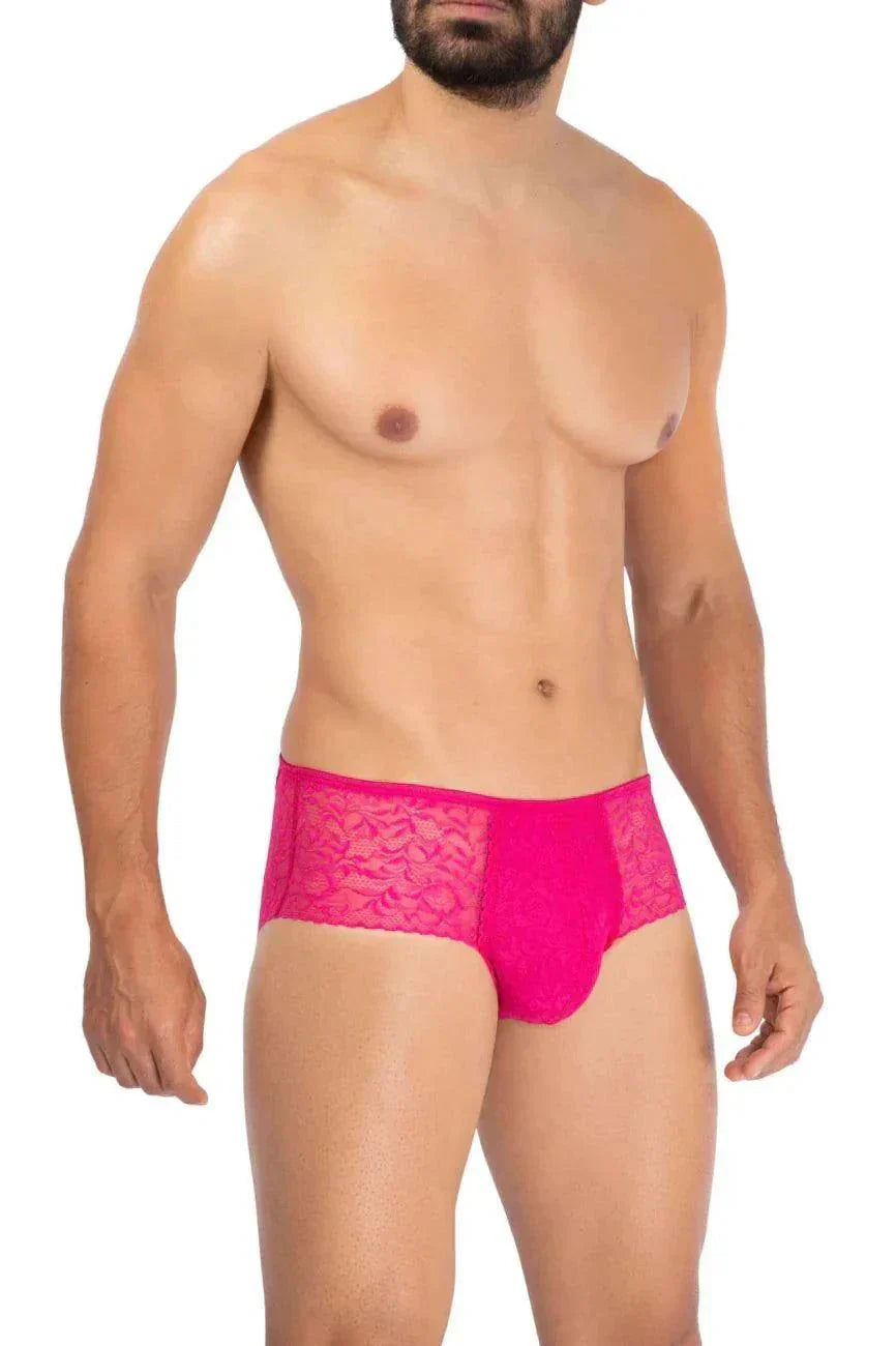 Male model wearing bright pink Prowler Lace Briefs with floral lace detailing and comfortable elastic waistband.