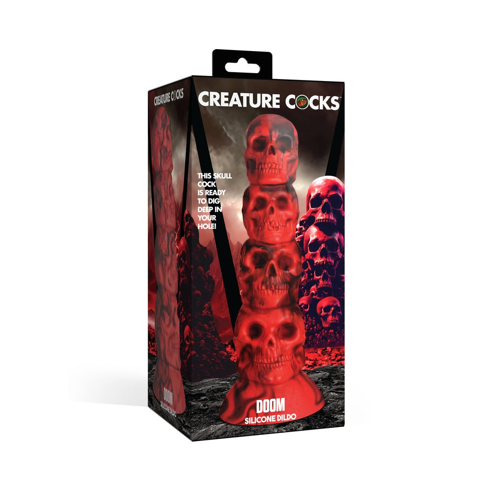 Creature Cocks Doom Silicone Dildo in packaging with red skull design.