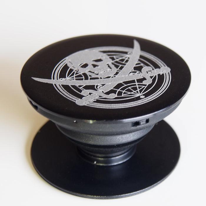 TIM METAL Pop Stand, etched metal design, secure phone grip accessory.