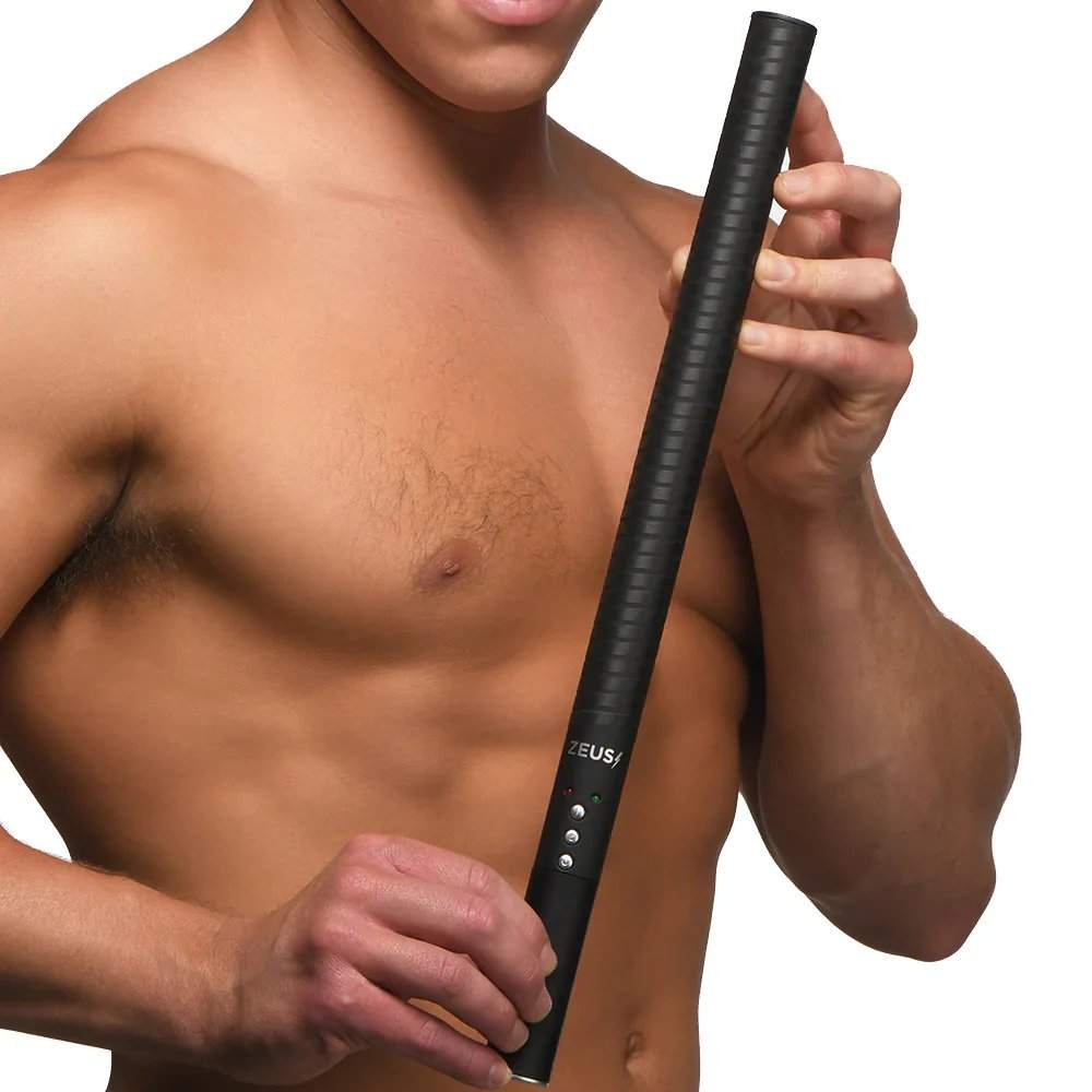 Man holding Zeus Electrosex E-Stim Baton electrostimulation device for intimate BDSM play