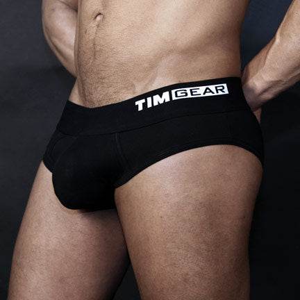 Male model wearing TIMGEAR Black Briefs with a sporty design and branded waistband