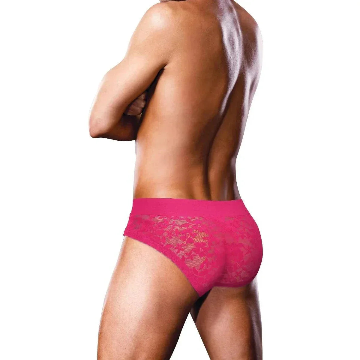 Man wearing vibrant pink Prowler Lace Briefs with floral lace detailing and elastic waistband.
