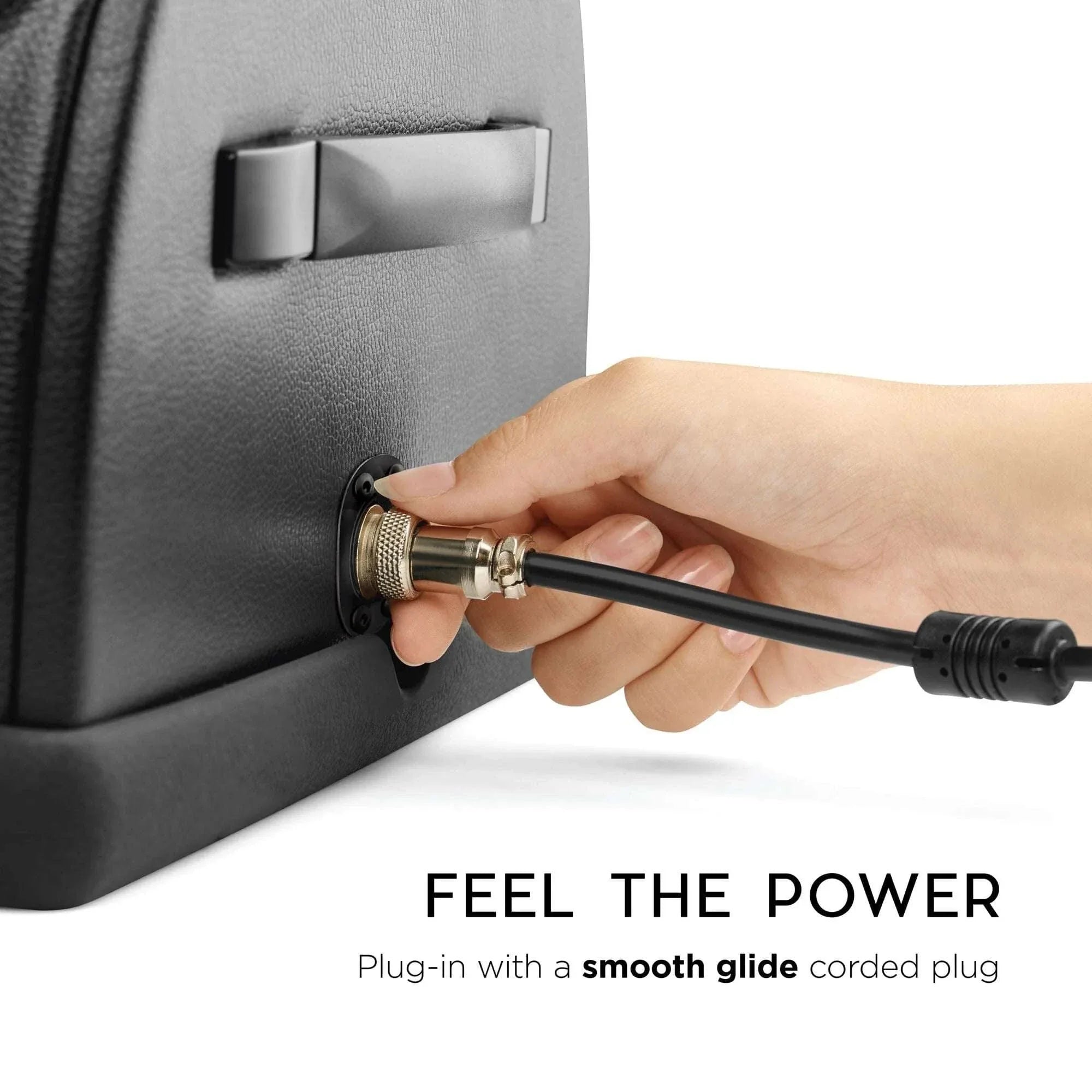 Close-up of hand plugging smooth glide corded power plug into The Cowgirl Premium Riding Sex Machine showing its easy power connection