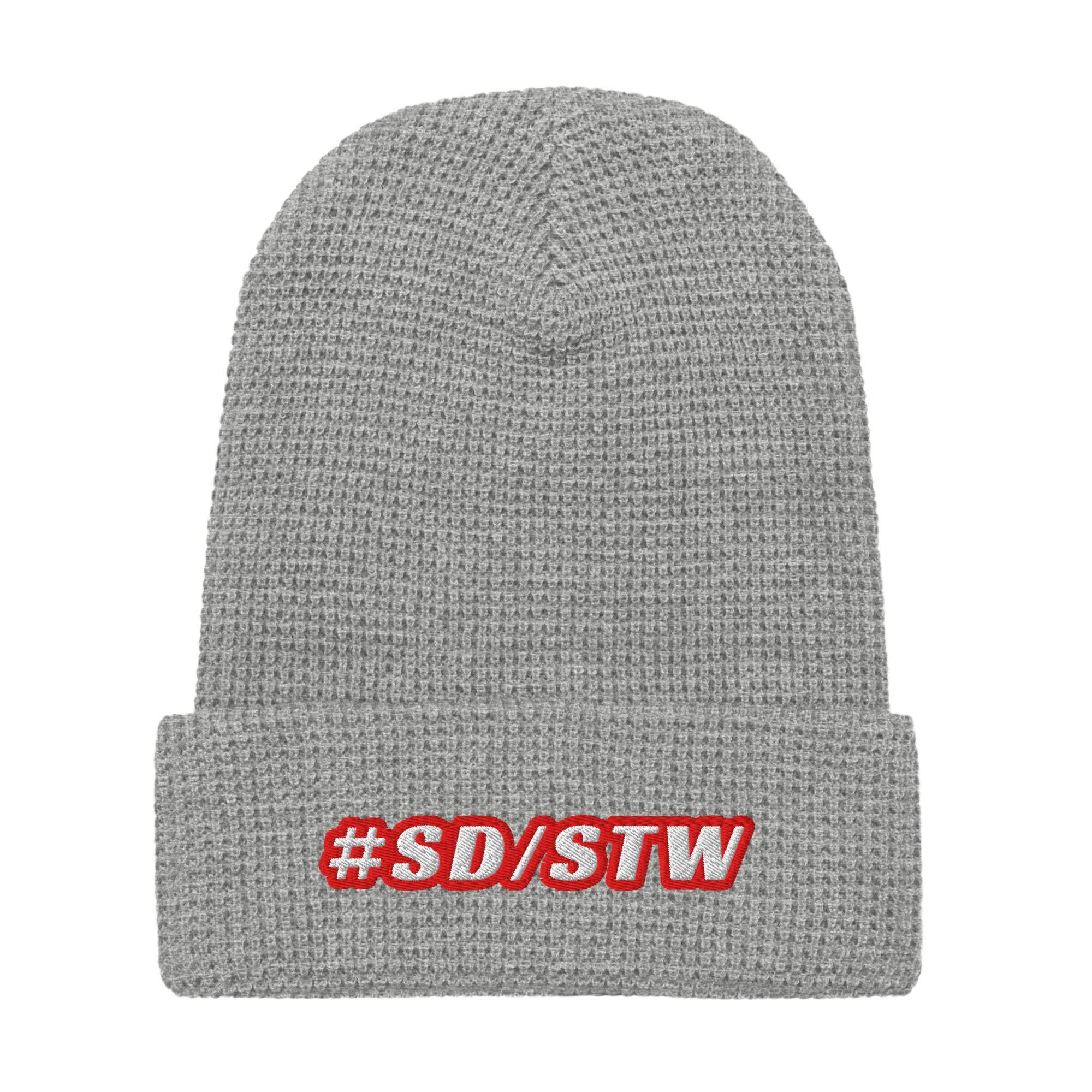Grey waffle knit beanie with #SD/STW embroidered in red on the cuff, made of 100% acrylic for warmth and style.