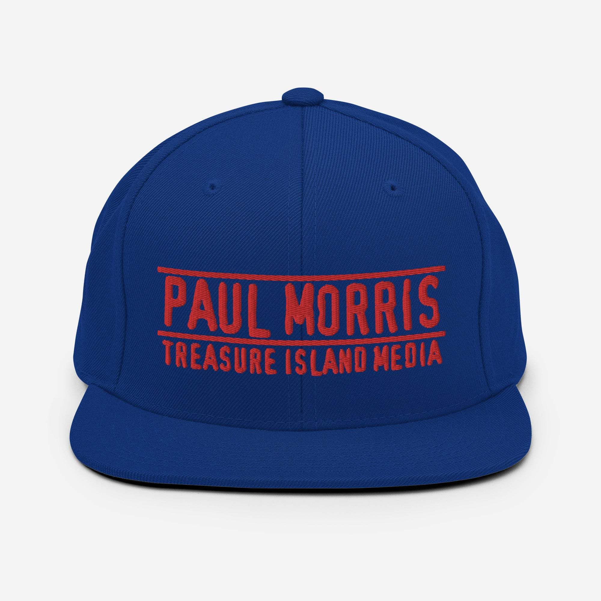 Paul Morris Edition Snapback Hat with red embroidered logo on blue fabric, flat brim, high-profile design.
