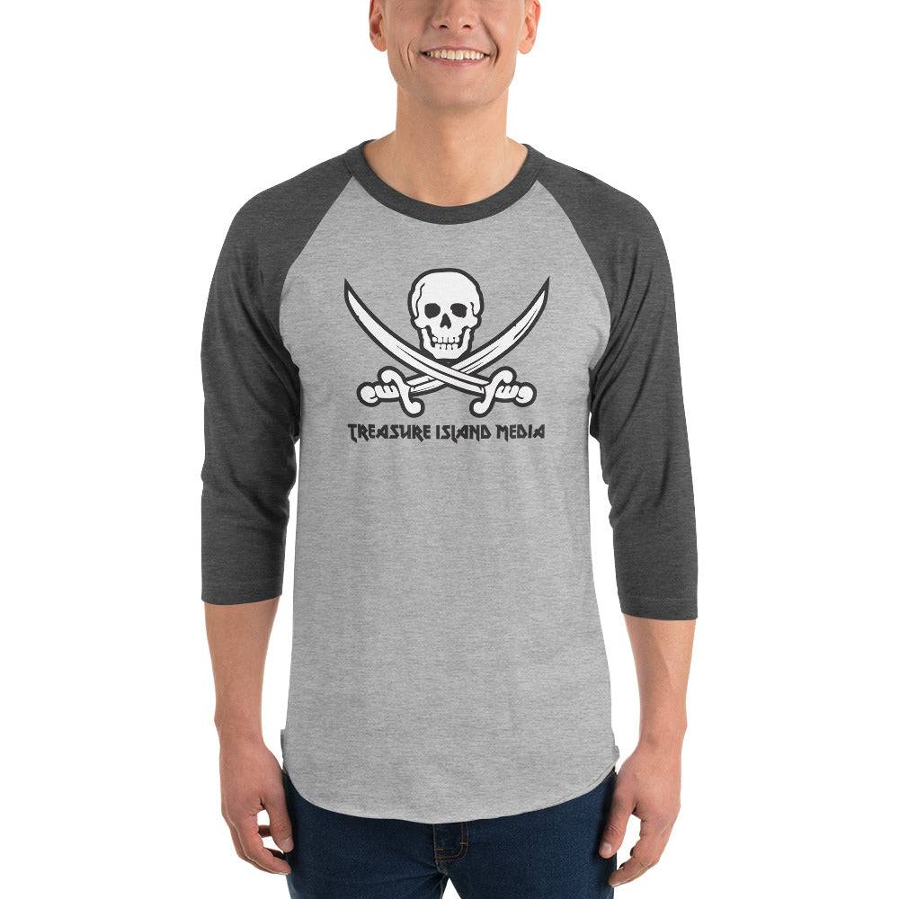 Man wearing a grey and black Treasure Island Media logo baseball t-shirt with skull and crossed swords design.