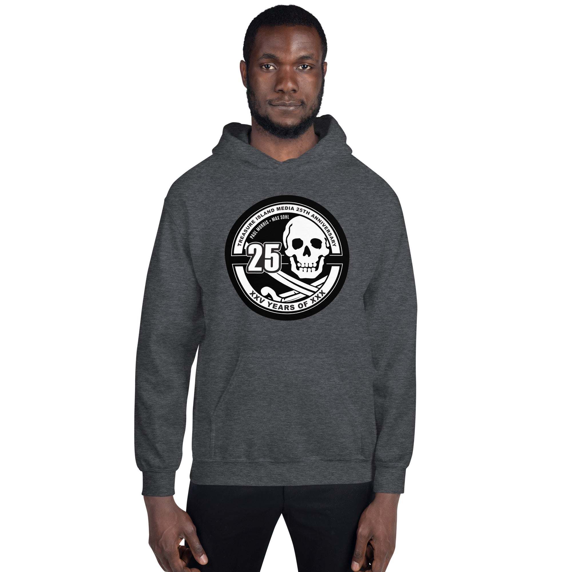 Man wearing dark gray TIM 25th Anniversary Circle Logo Hoodie with skull and number 25 emblem on front