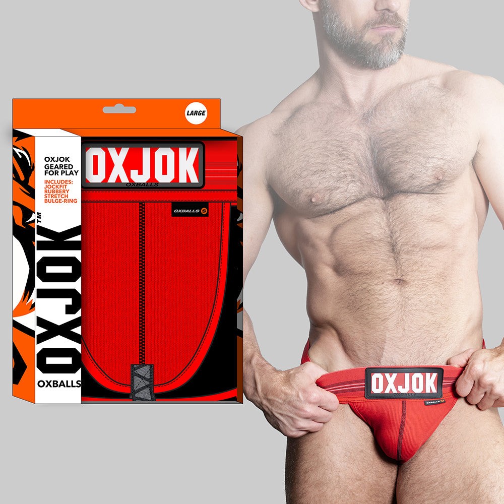Red Oxballs Oxjok Slingjock Upthrust Slider-Strap jockstrap with soft rib pouch, adjustable straps, and branded waistband on male model