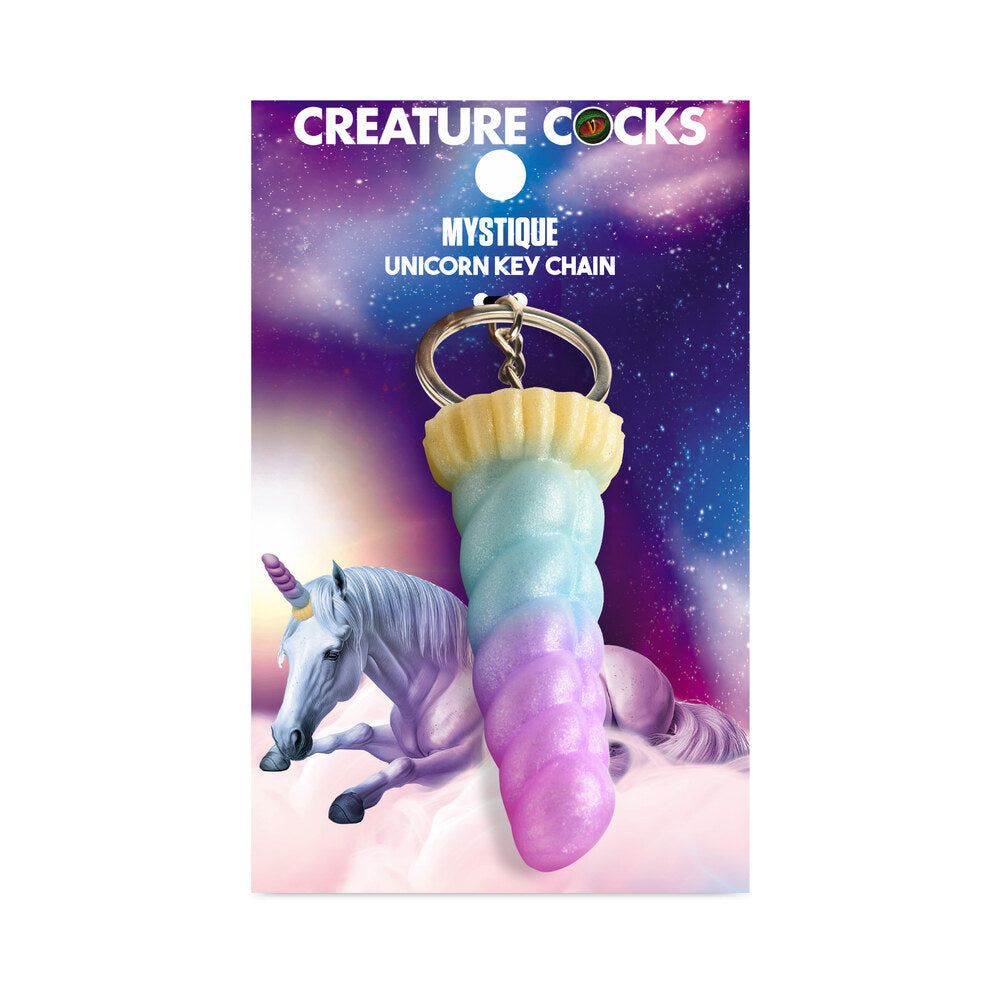 Creature Cocks Mystique Unicorn pastel silicone keychain with unicorn horn design on space-themed packaging