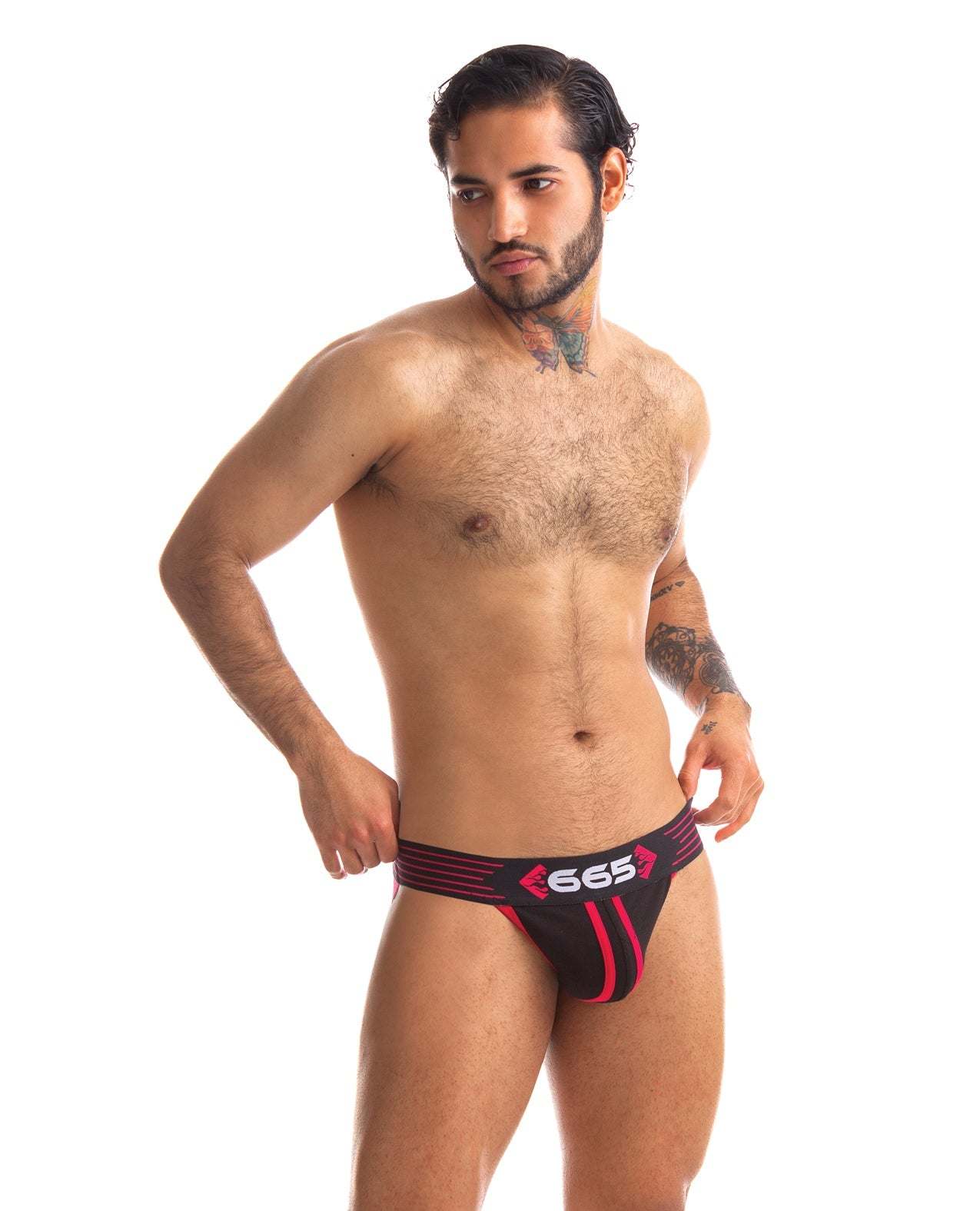 Man wearing black and red 665 Rally Jockstrap with bold logo waistband