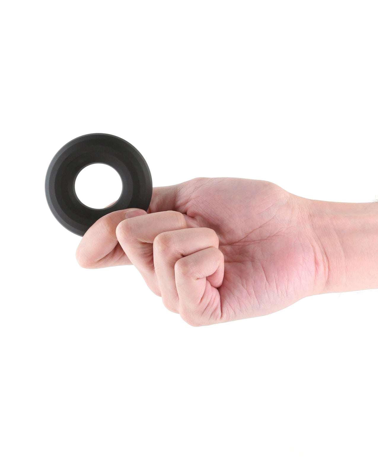 Renegade Fireman large black liquid silicone cock ring held in hand for comfort and performance enhancement