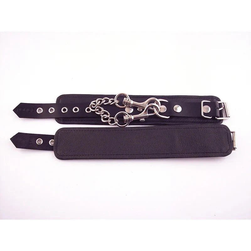 Black leather Rouge Wrist Cuffs with adjustable buckle straps and detachable double trigger hook chain