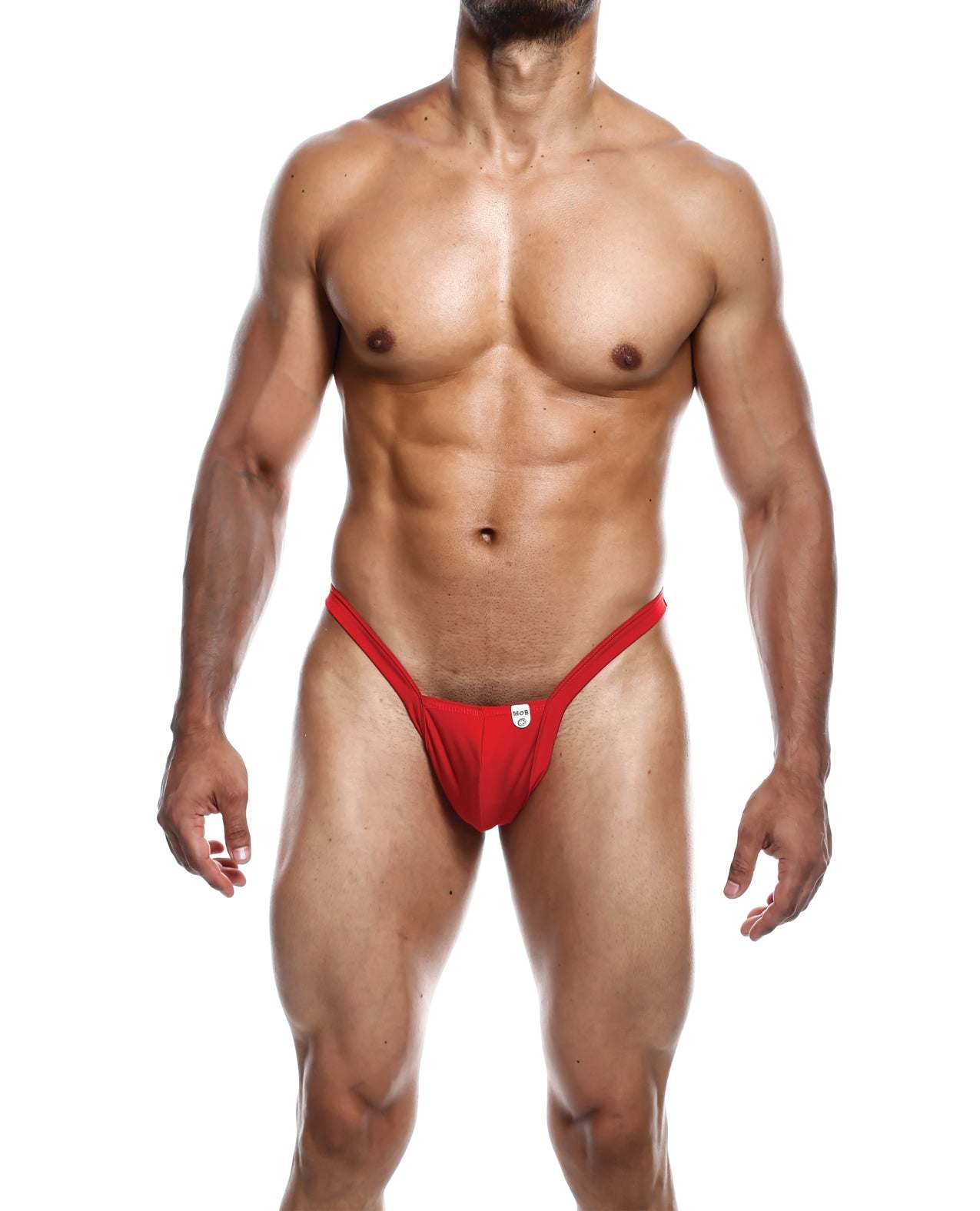 Muscular man wearing red Male Basics Y Buns Thong with thin V-straps showcasing fit physique.