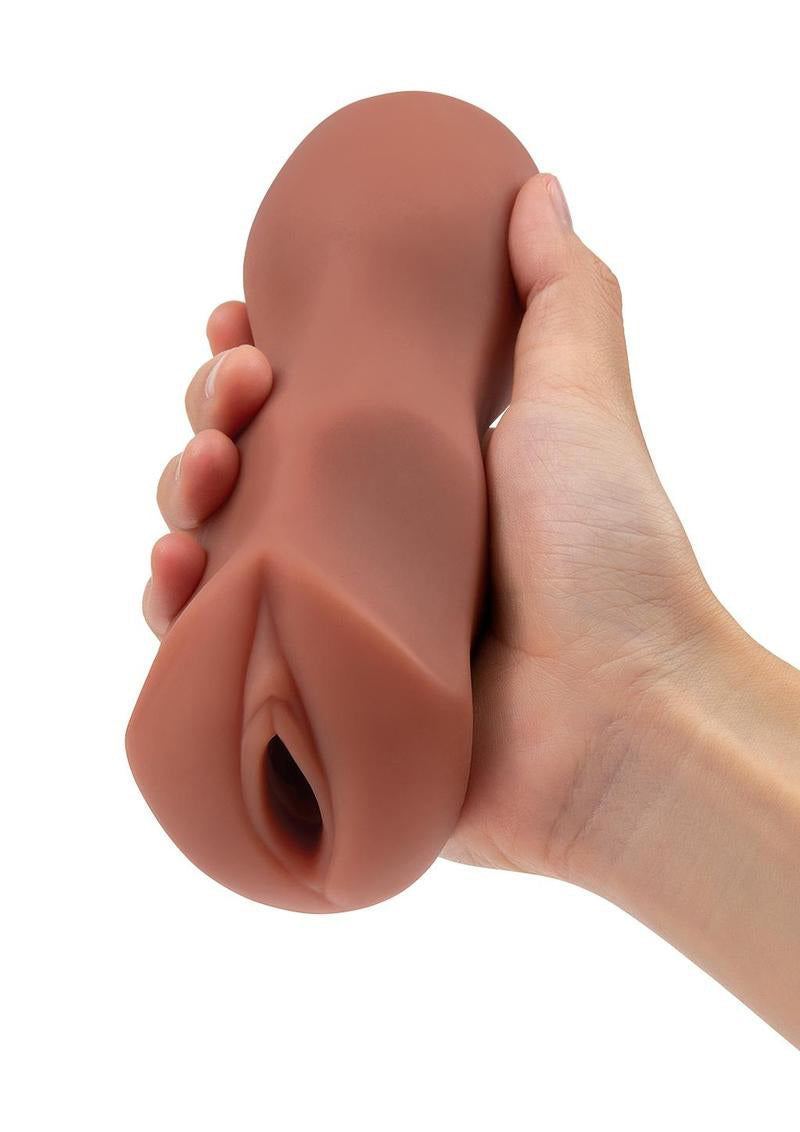 Hand holding medium-sized Stroke Off Thai Stroker with realistic texture and body-safe material.