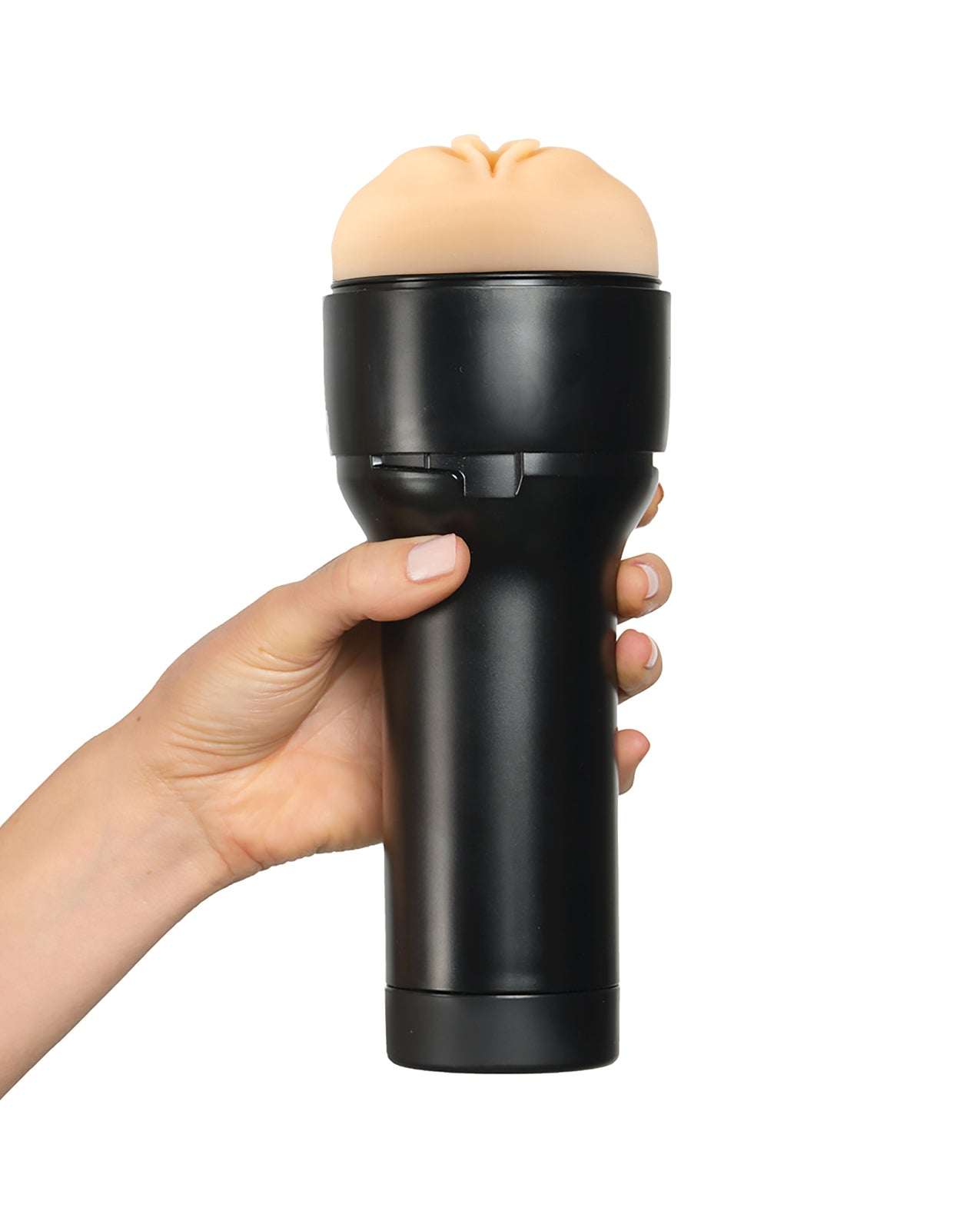 Kiiroo Feel Stroker pale textured male masturbator with black handle held in hand