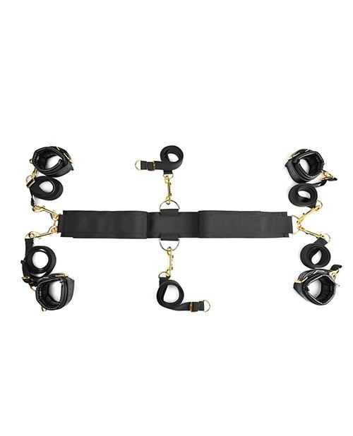 Under The Bed Restraint System with adjustable black straps, gold hardware, and faux leather cuffs for wrists and ankles