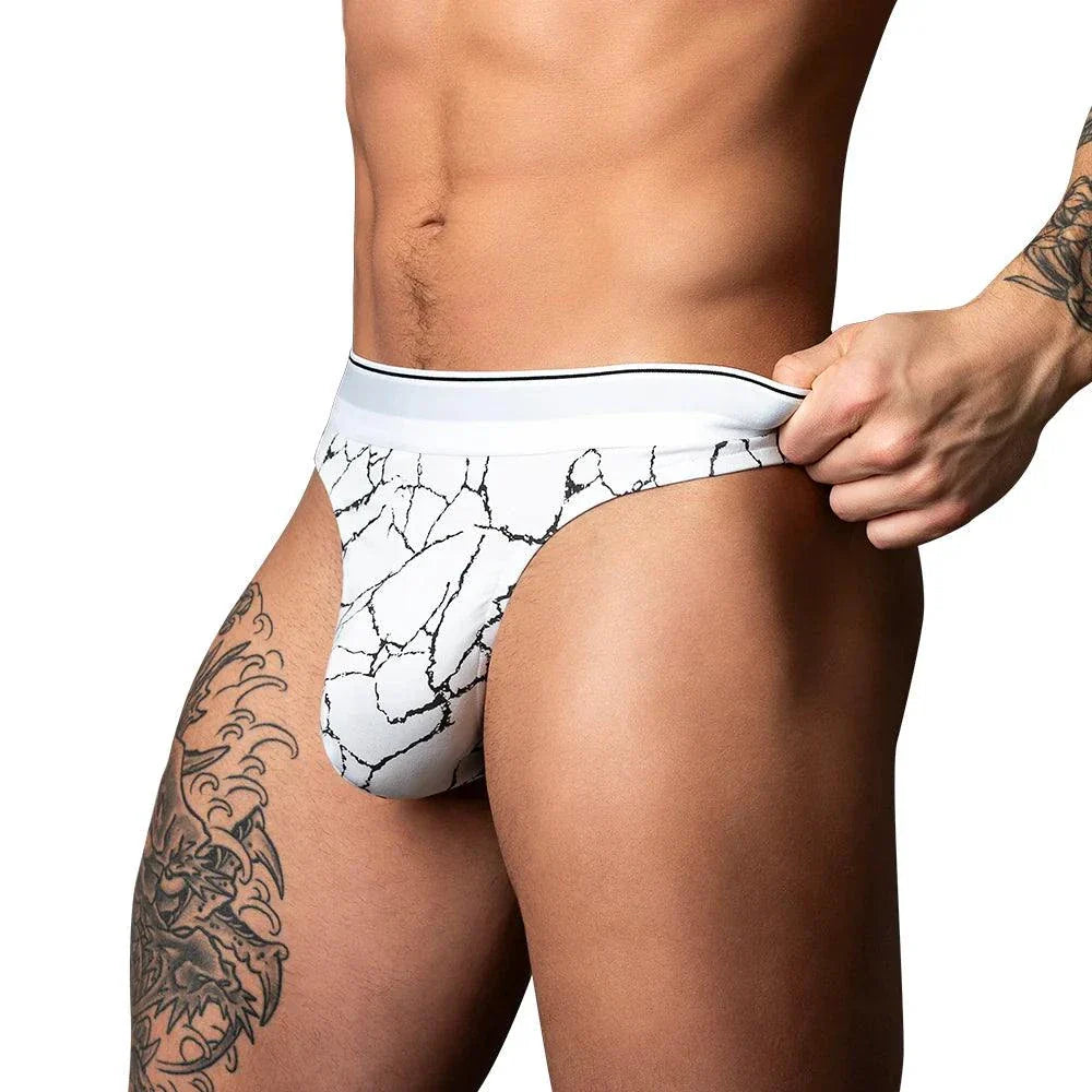 Male Power Soo Cumfy Thong in black and white marble print, low-rise with contoured pouch and elastic waistband for men size S/M