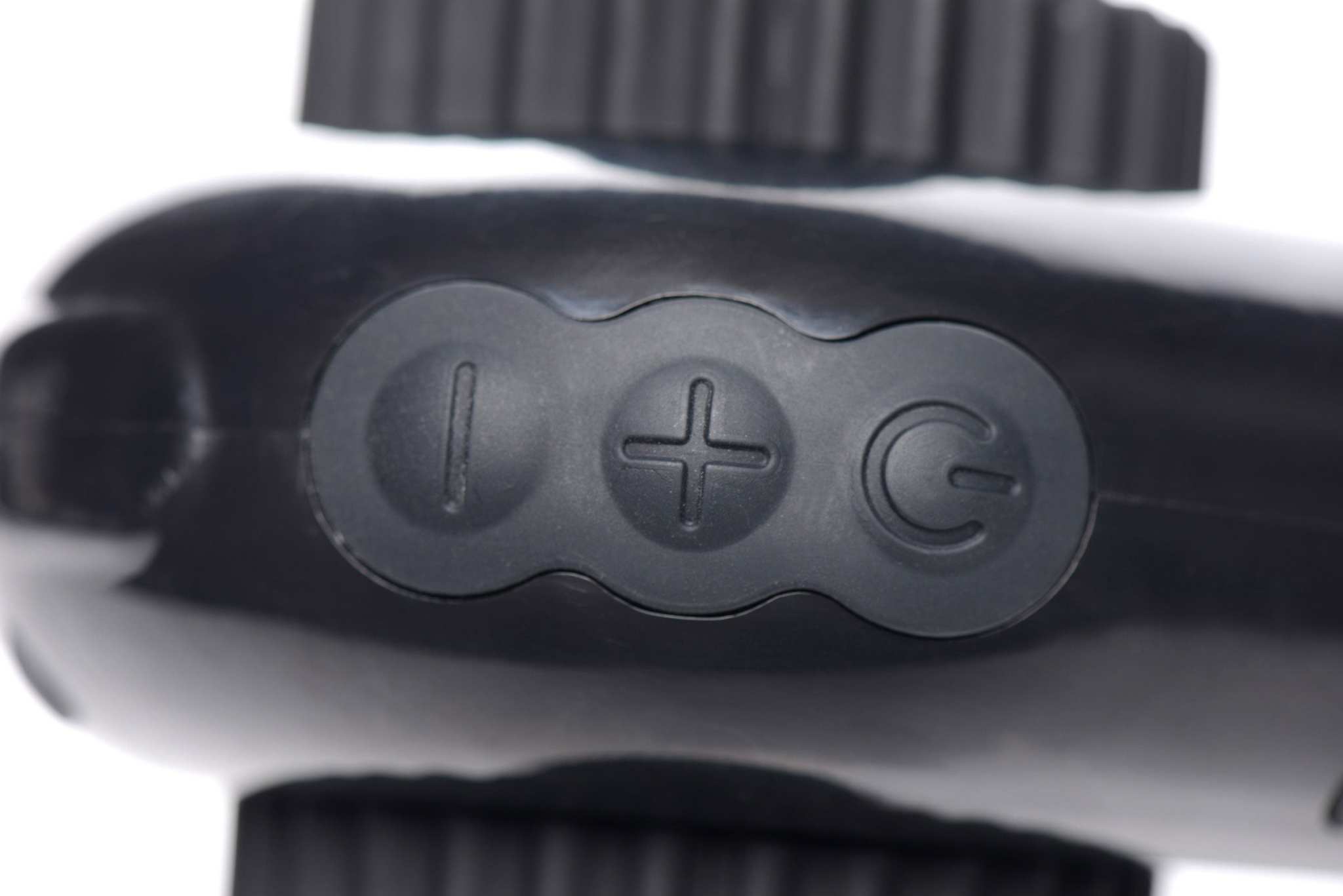 Close-up of Pro-Bang Sex Machine remote control buttons for power and speed adjustment
