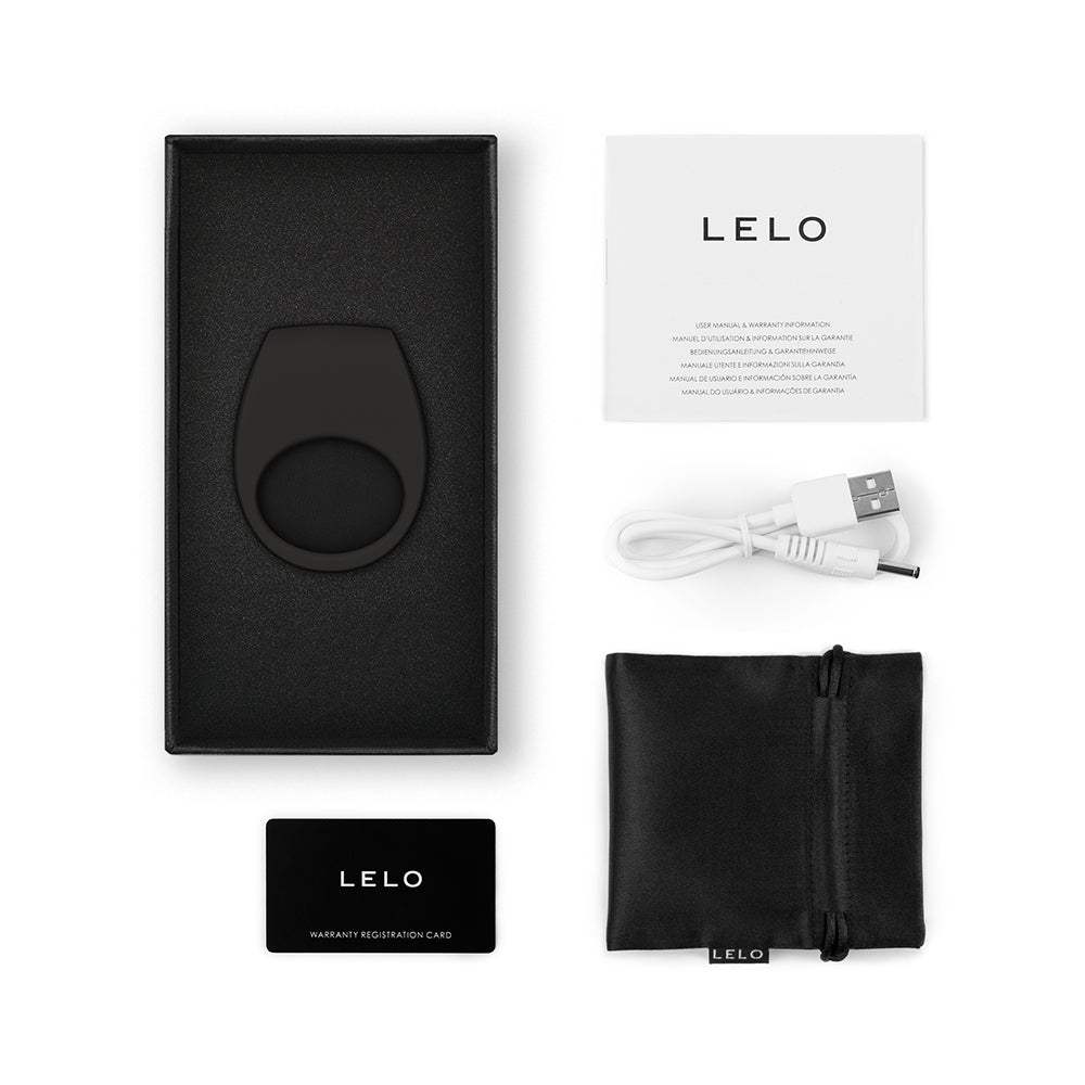 LELO TOR 3 black vibrating silicone cockring with USB charger, warranty card, user manual, and storage pouch in packaging