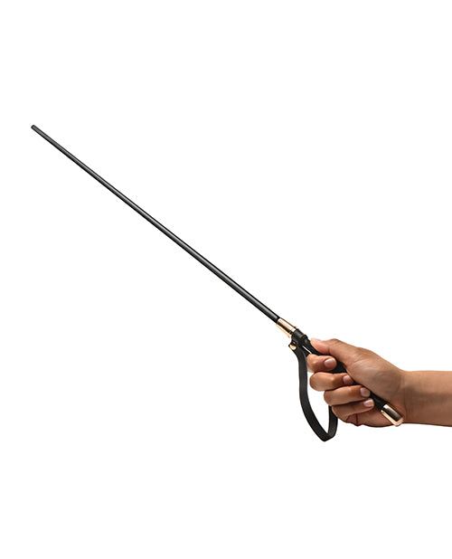 Black and gold Master Series Sinful Impact Cane with ergonomic vegan leather handle and gold caps held in hand