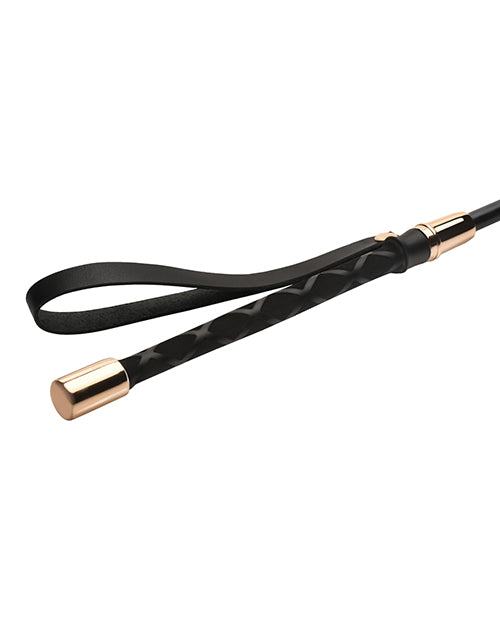 Master Series Sinful Impact Cane in black with gold caps and vegan leather handle for precise BDSM play