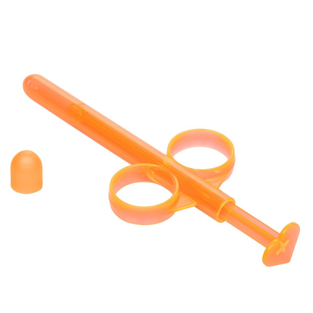 Orange reusable Lube Tube with ergonomic finger loops and precision tip for controlled lubricant application