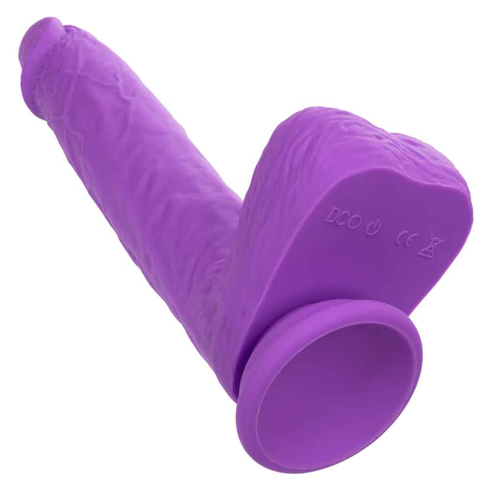 Purple rechargeable gyrating and thrusting silicone stud with suction cup base and textured surface.