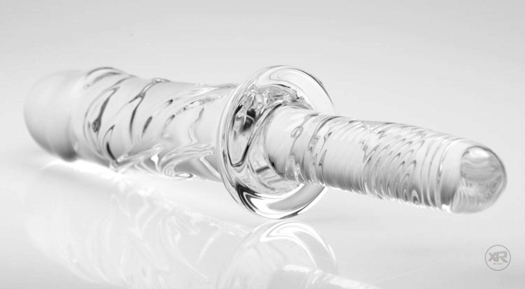Clear textured Brutus Glass Dildo Thruster with grooved handle and ridged shaft for enhanced internal massage and temperature play, 6.5 inches insertable.