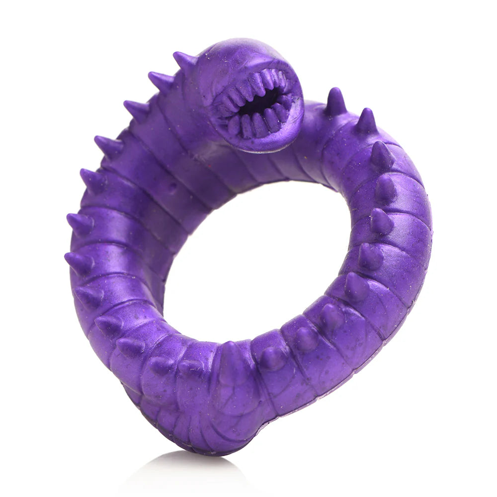 Purple silicone cock ring with a toothy, spiked design resembling a galactic worm.