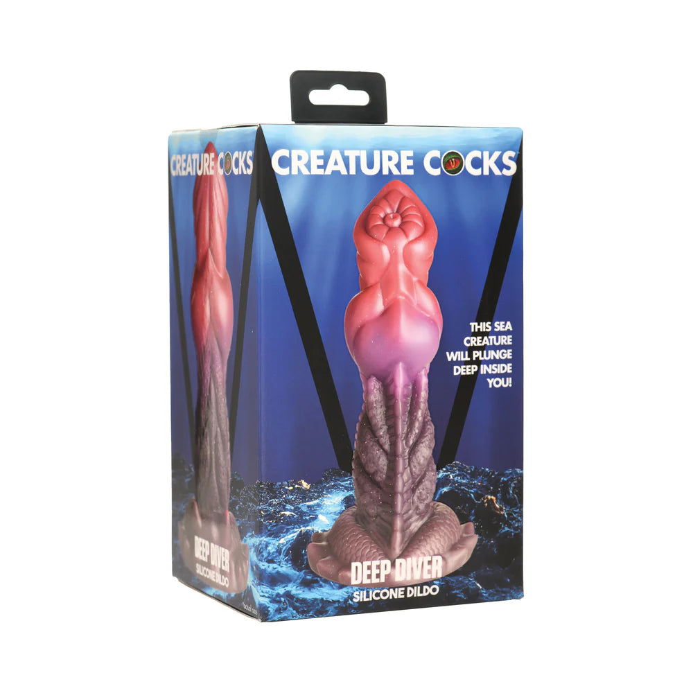 Creature Cocks Deep Diver Silicone Dildo in packaging showing textured fantasy design and vibrant colors.