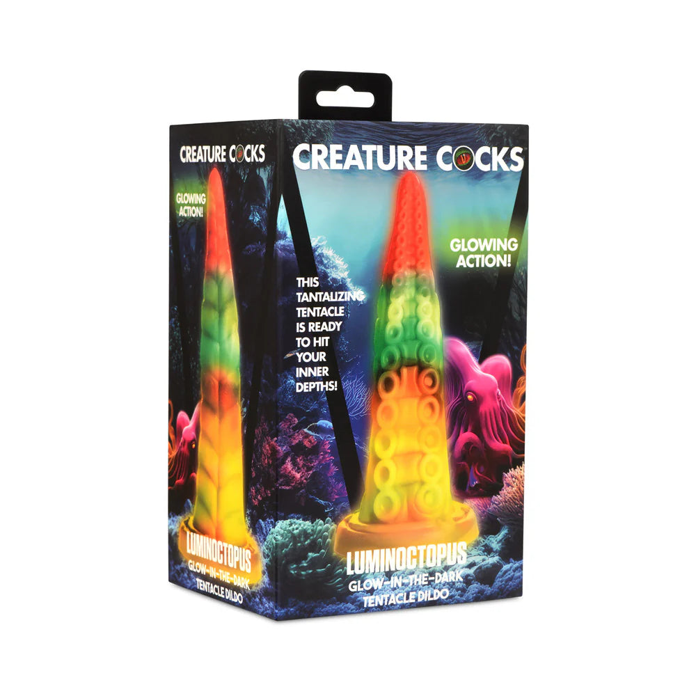 Glow-in-the-dark rainbow tentacle dildo packaging with vibrant neon colors and fantasy sea theme.