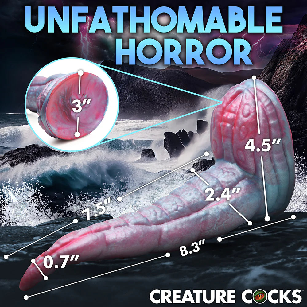 Creature Cocks Tentacle Cock Silicone Dildo with red and blue tentacle design on rocky shore background.