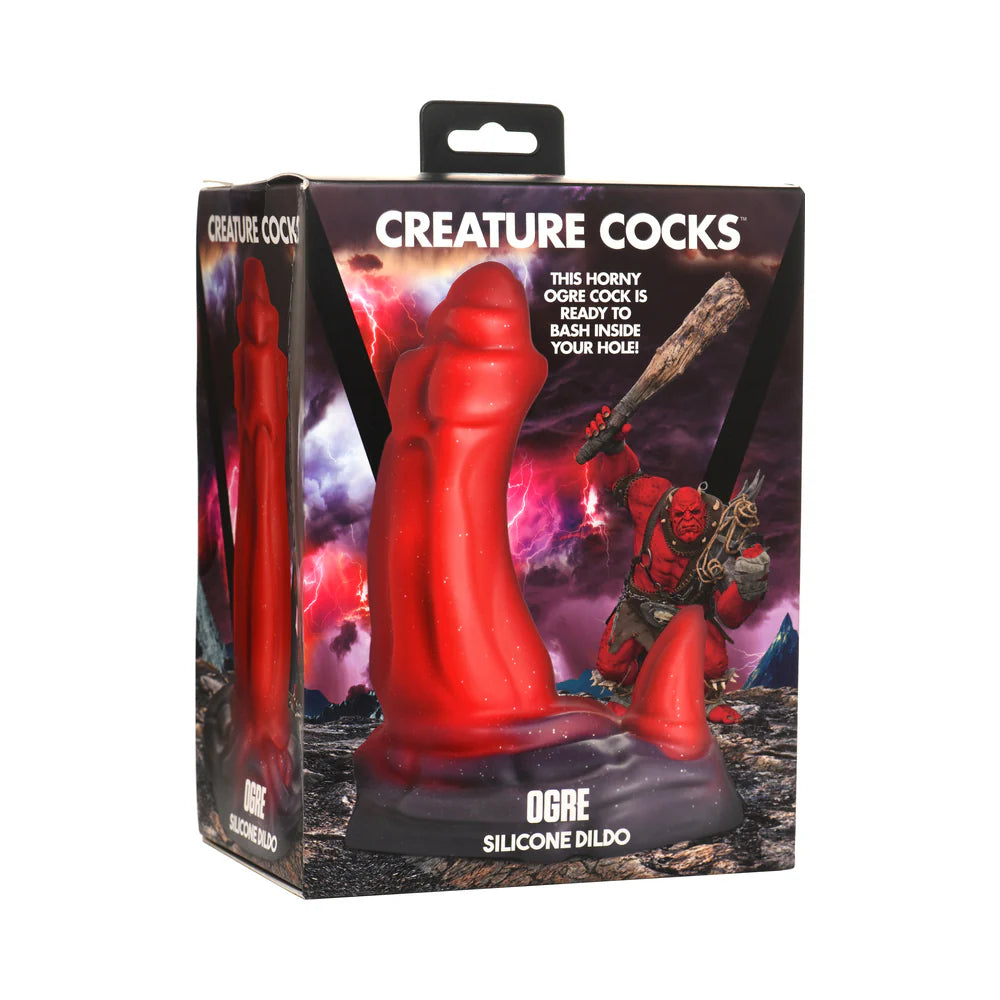 Creature Cocks Ogre Silicone Dildo in packaging with red, knobby design and glittery finish.