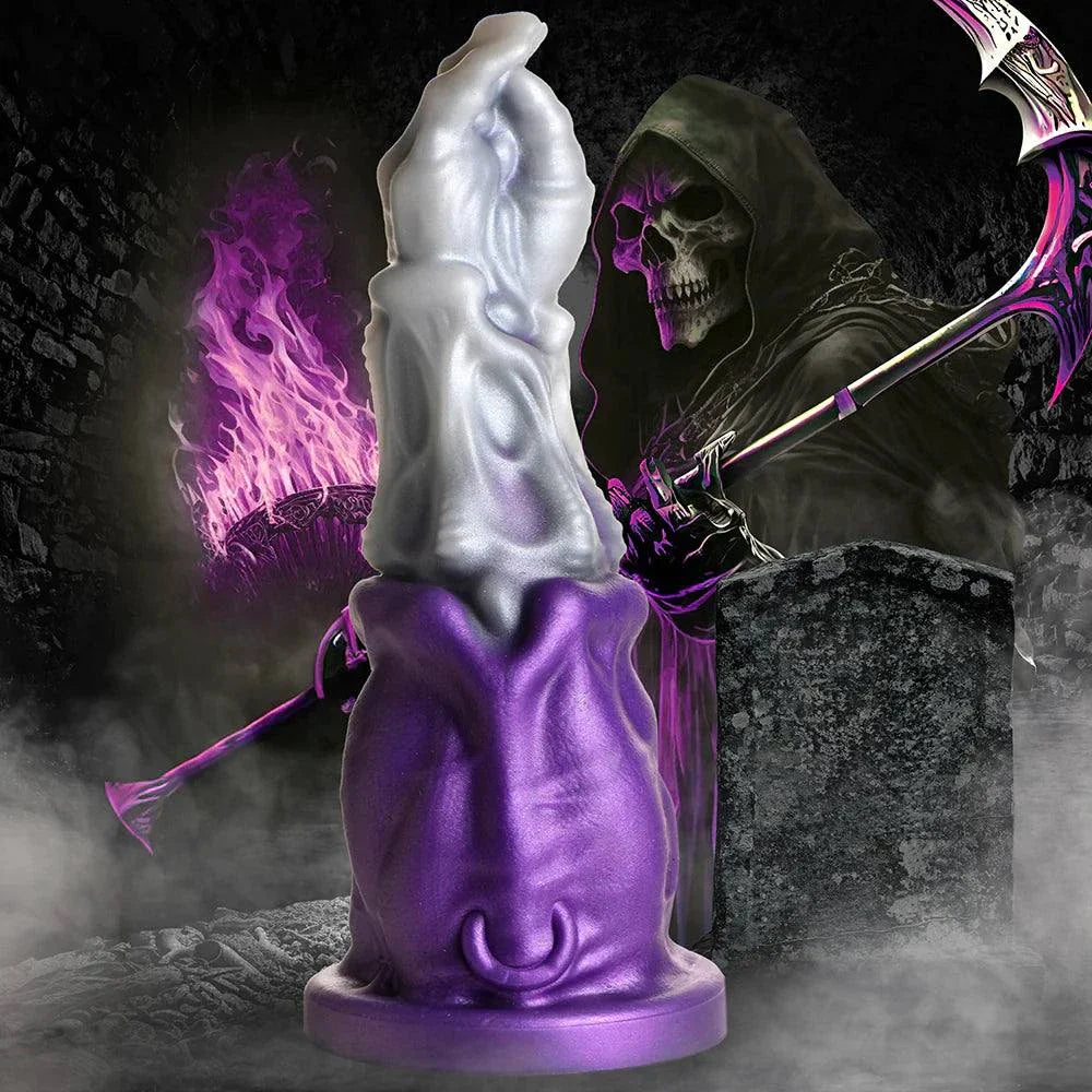 Creature Cocks Grim Reaper Silicone Dildo with purple cloak and silver details, featuring a suction base for hands-free play.