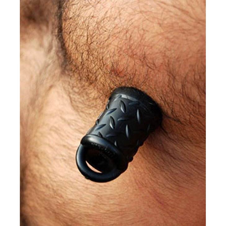OxBalls Gripper Nipple Suckers in use, showcasing black faux diamond plate texture and strong suction grip on the skin.