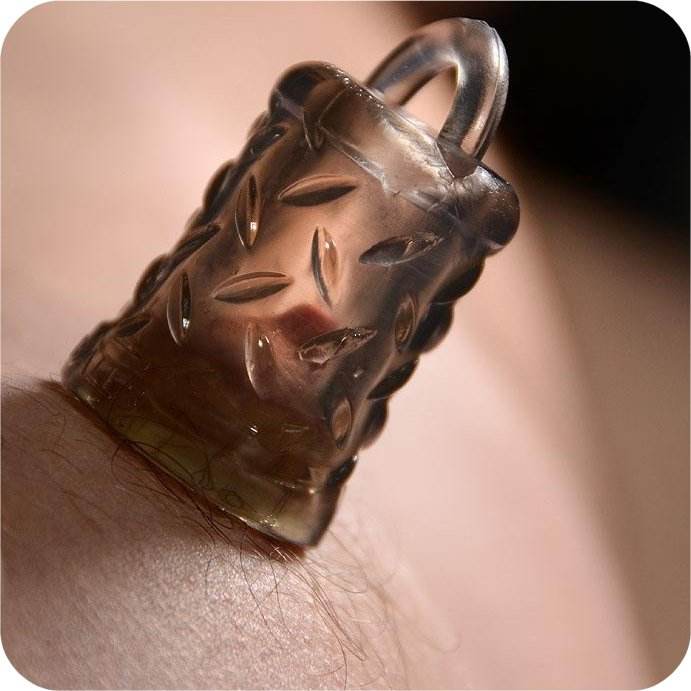 OxBalls Gripper Nipple Sucker on skin with snakebite design, showcasing firm grip and clear material for visual play.