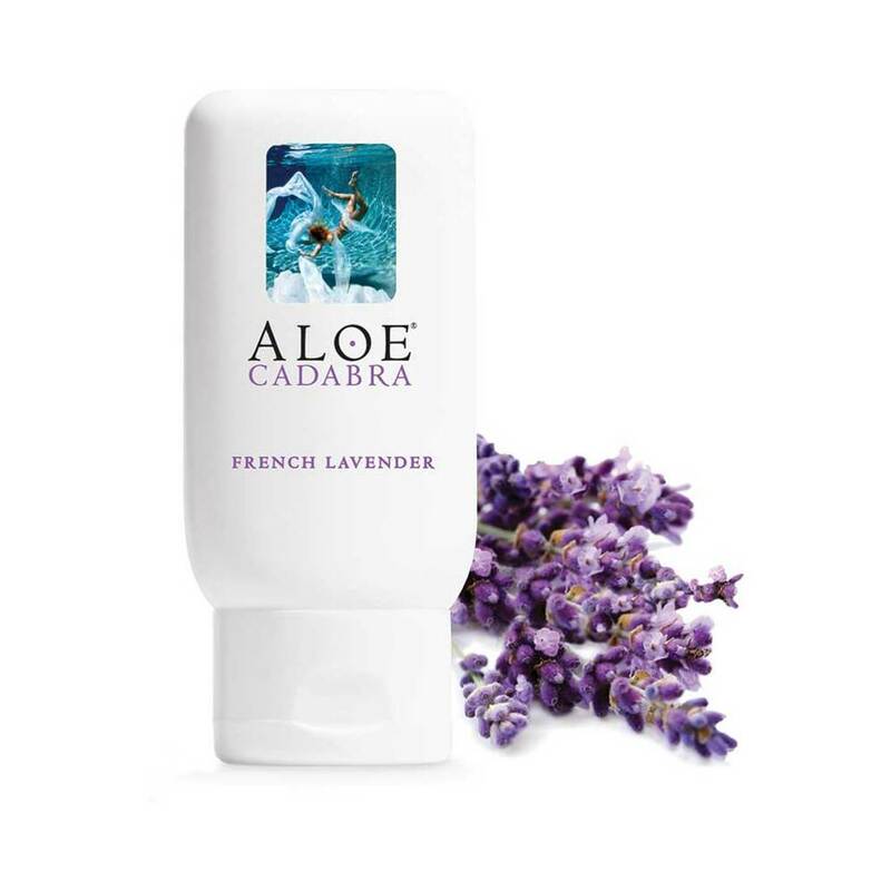 Aloe Cadabra French Lavender Aloe Lubricant 2.5 oz bottle with lavender flowers in the background.