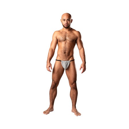 Male model wearing Male Power Labyrinth Posing Strap in grey weave with minimal coverage on white background