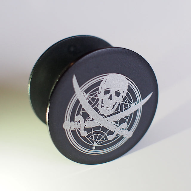 TIM METAL Pop Stand with etched skull design for secure phone grip.