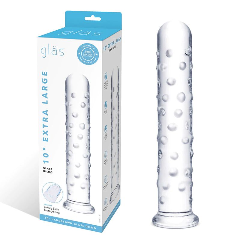 Glas 10 in. extra large clear glass dildo with textured surface and flared base next to its packaging box.